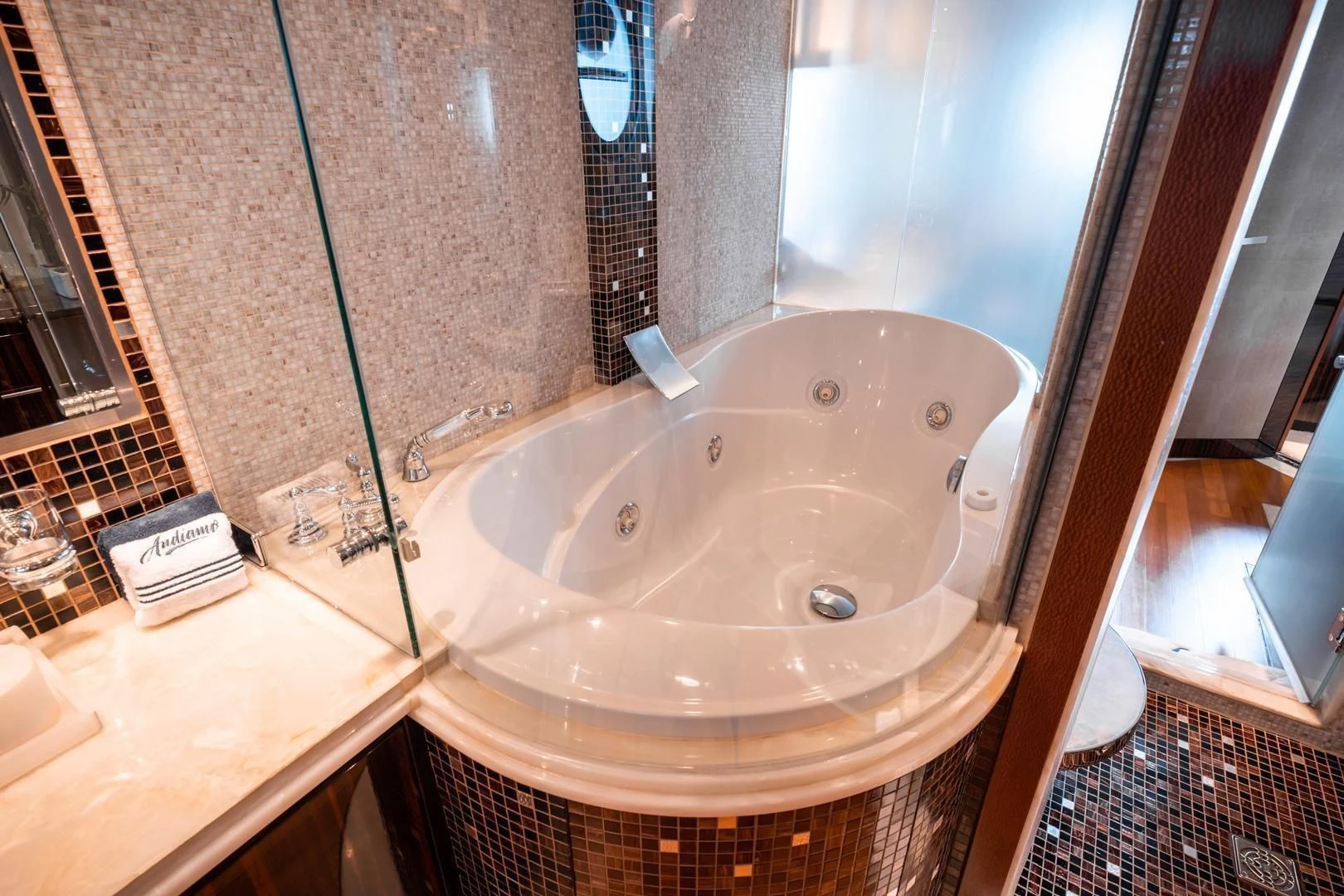 a large white bathtub in a bathroom aboard AQUANOVA Yacht for Sale