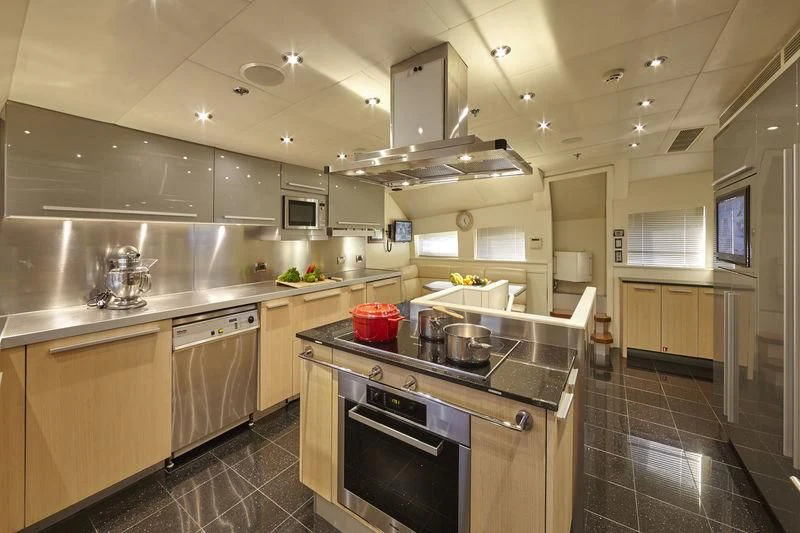 a kitchen with a stove and a sink aboard AQUANOVA Yacht for Sale