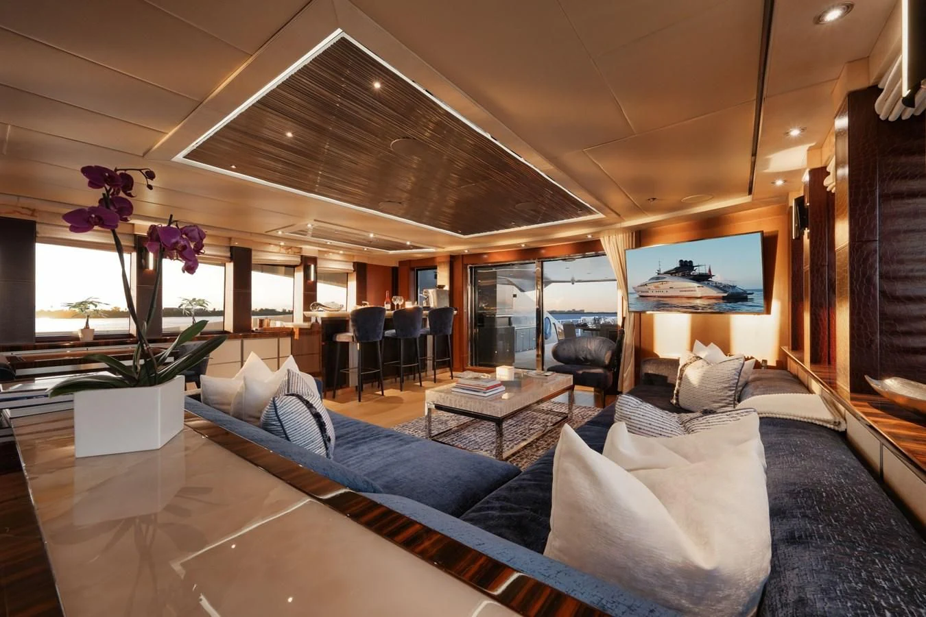 a living room with a large open window aboard AQUANOVA Yacht for Sale