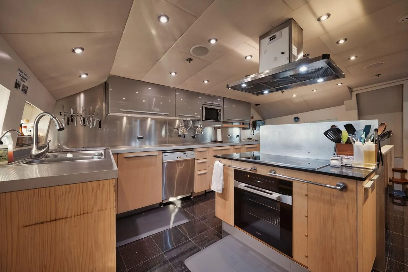 a kitchen with a stove and oven aboard AQUANOVA Yacht for Sale