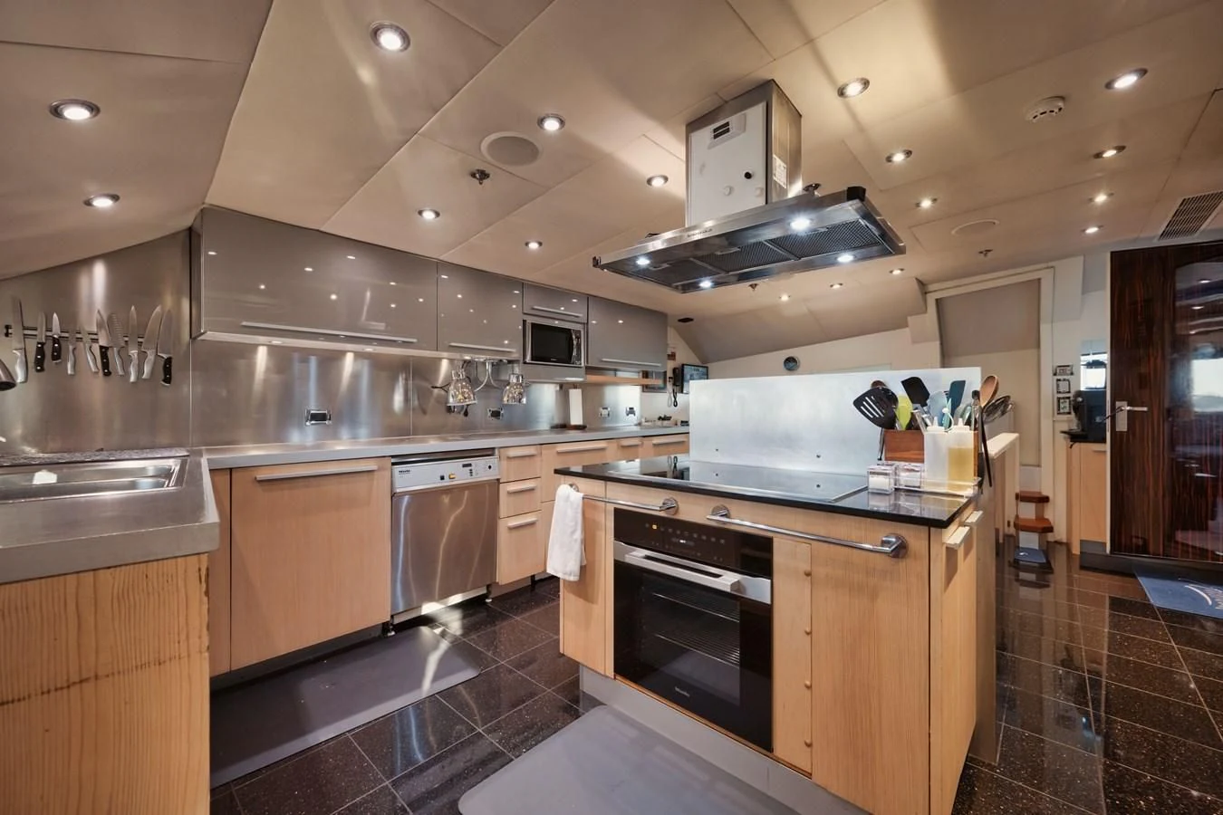 a kitchen with a stove and oven aboard AQUANOVA Yacht for Sale