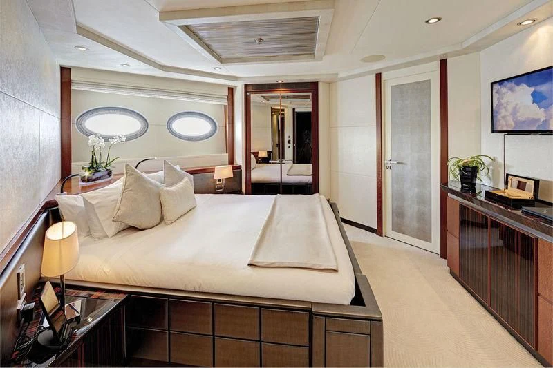 a hotel room with a large bed aboard AQUANOVA Yacht for Sale