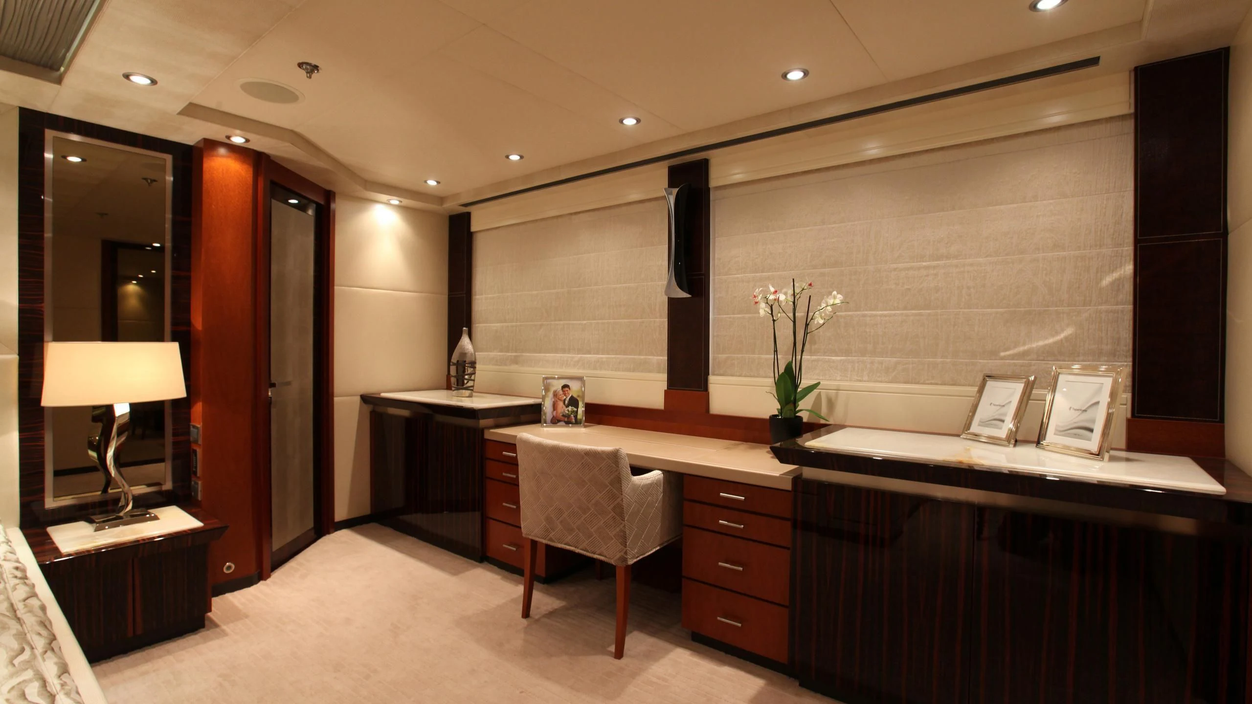 a large kitchen with a counter and chairs aboard AQUANOVA Yacht for Sale