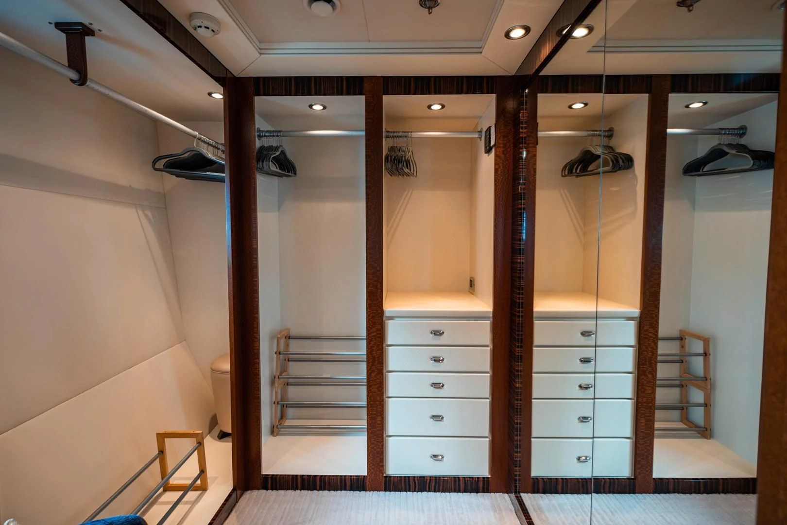 a room with a wood door and a wood staircase aboard AQUANOVA Yacht for Sale