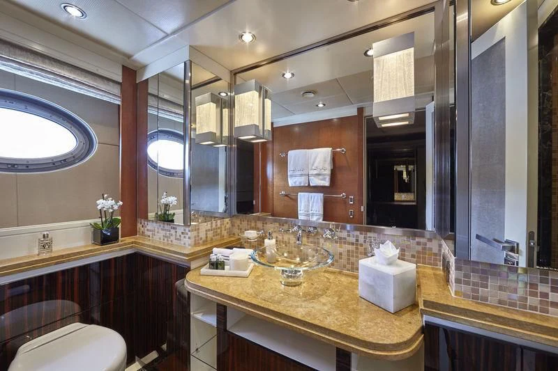 a bathroom with a large mirror aboard AQUANOVA Yacht for Sale