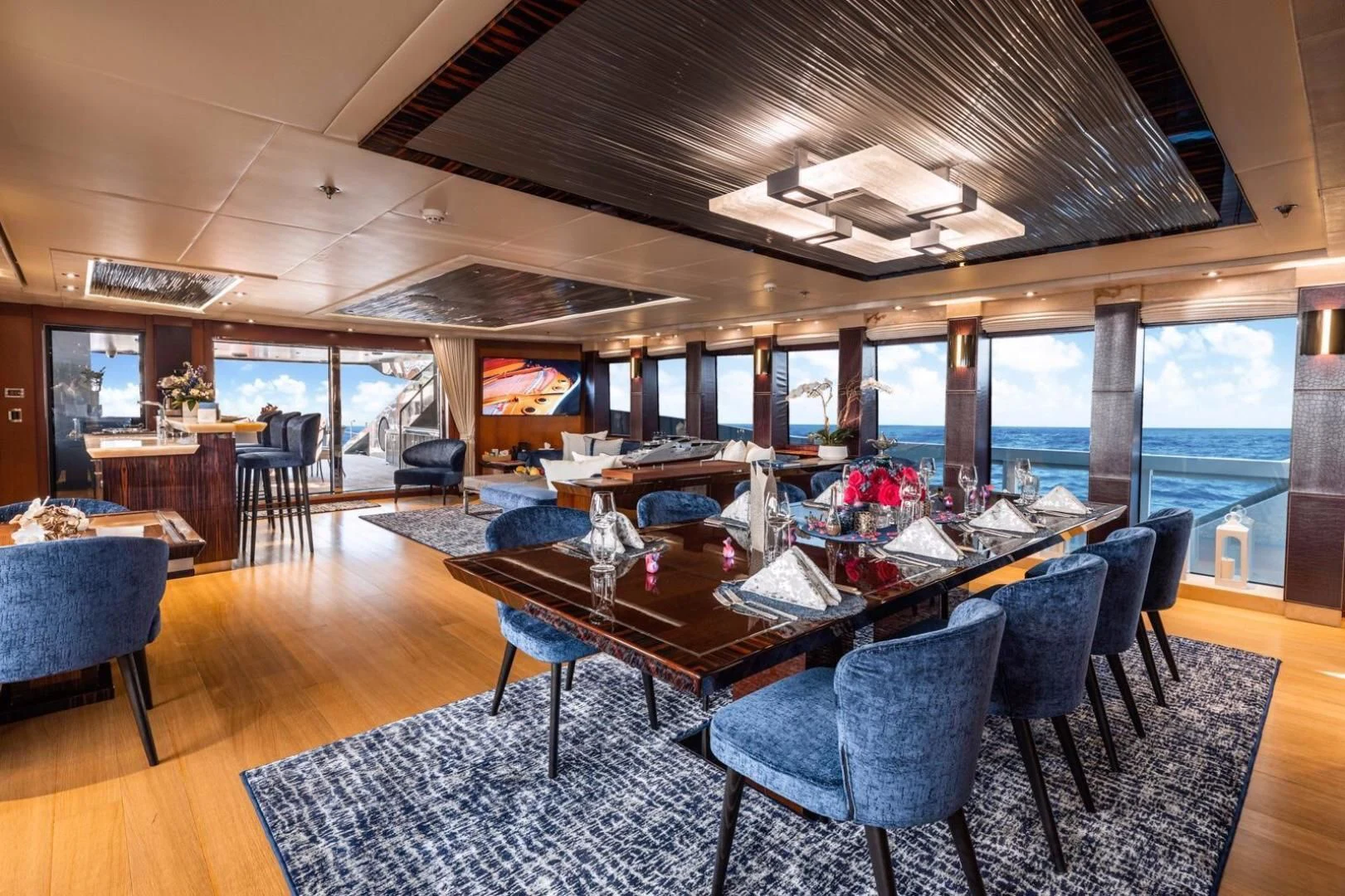 a large room with tables and chairs aboard AQUANOVA Yacht for Sale