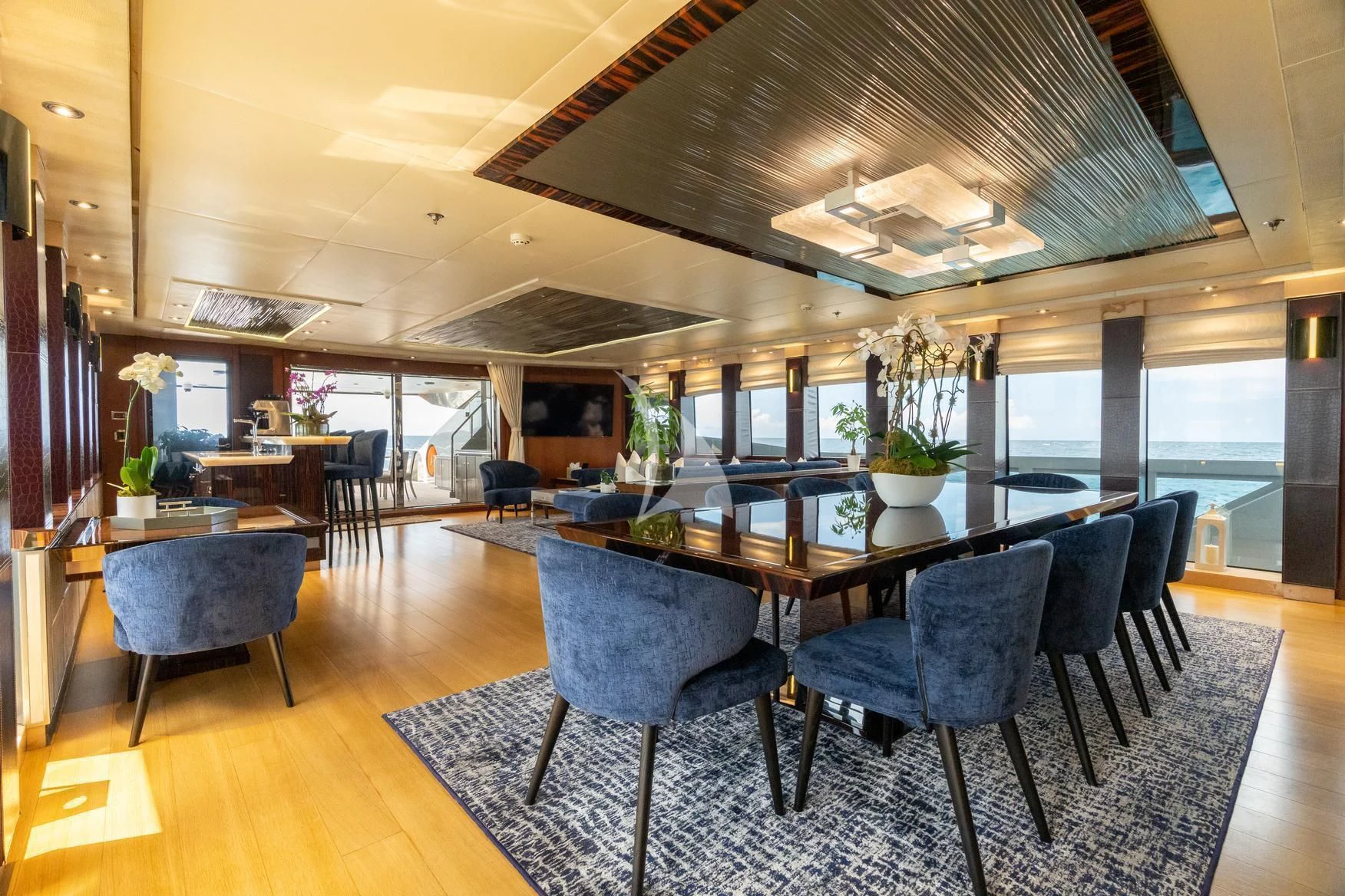 a large dining room with a table and chairs aboard AQUANOVA Yacht for Sale