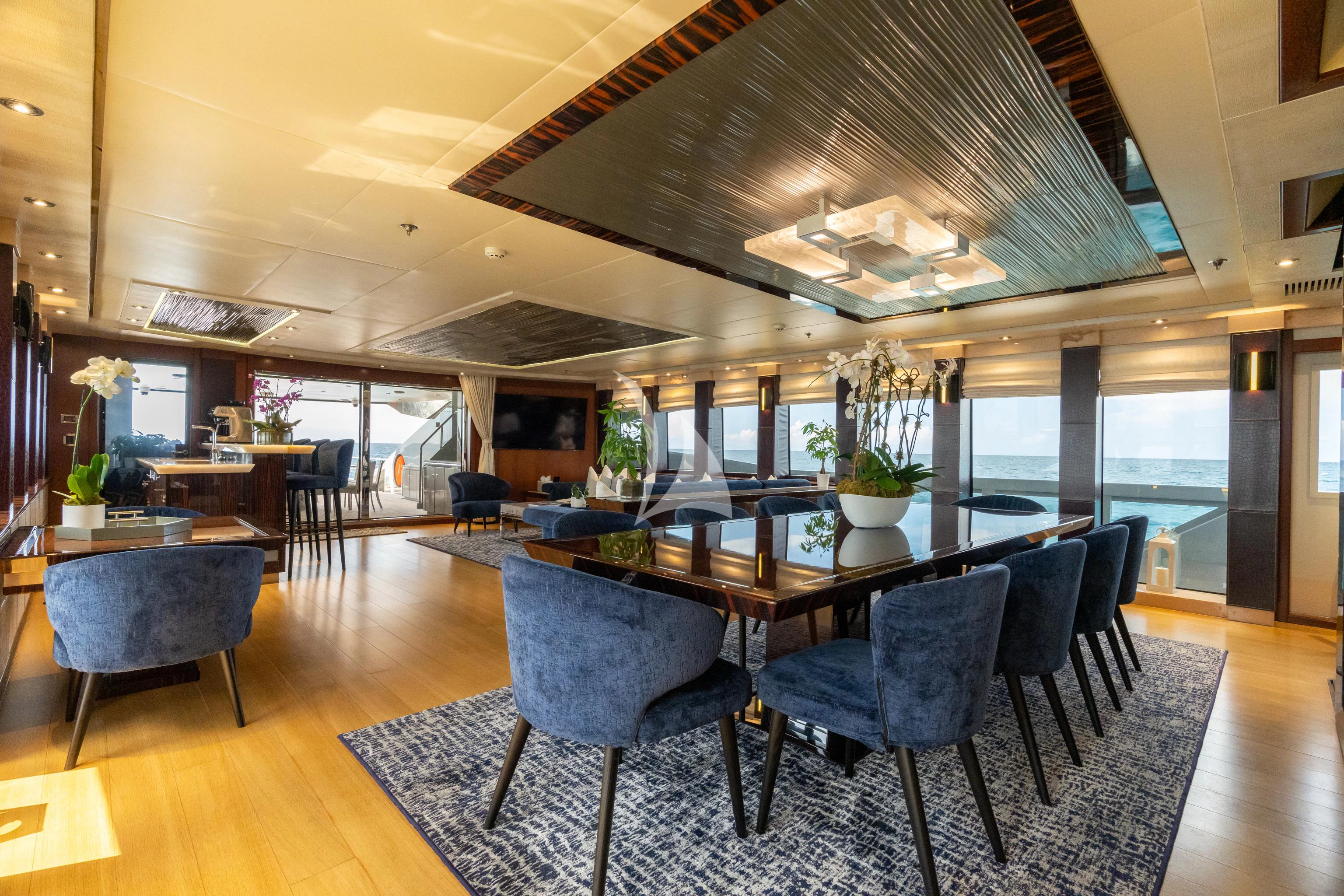 a large room with a table and chairs aboard AQUANOVA Yacht for Sale