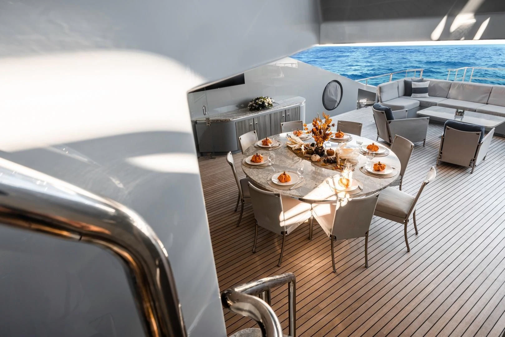 a dining room with a large white table and chairs aboard AQUANOVA Yacht for Sale