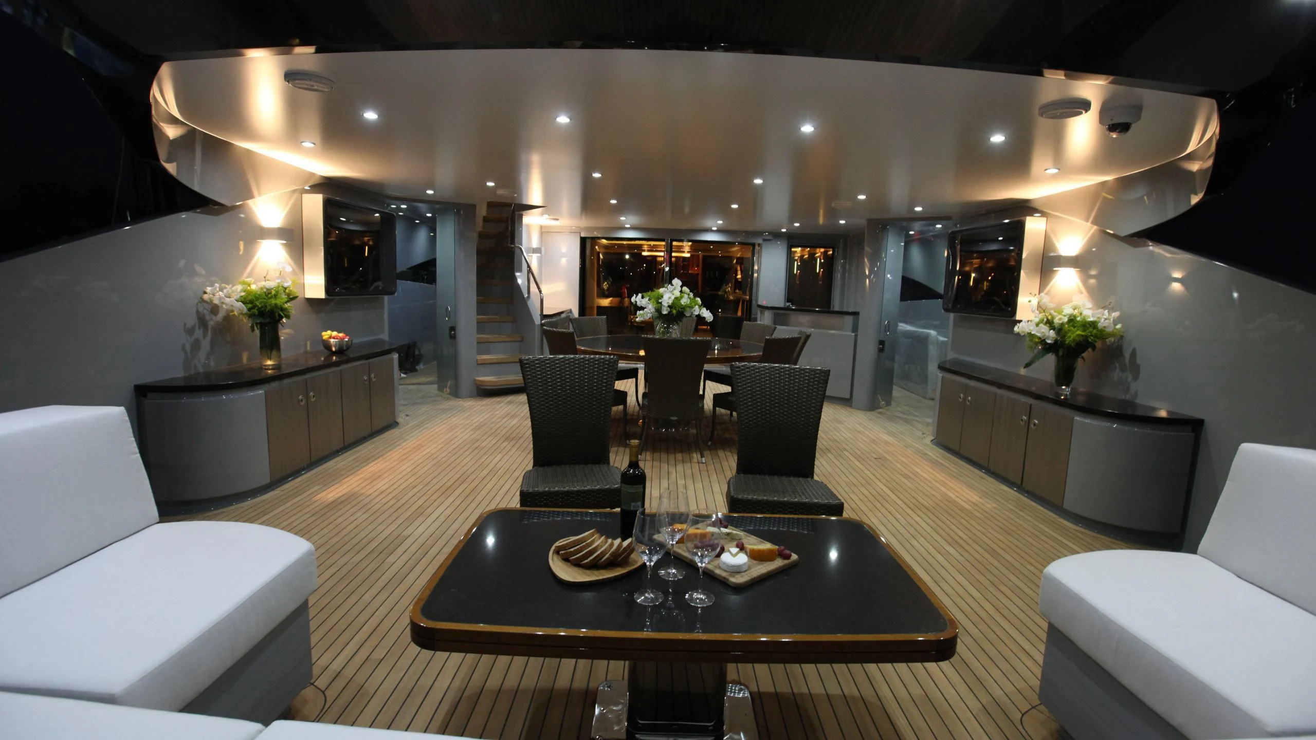 a large room with a table and chairs aboard AQUANOVA Yacht for Sale