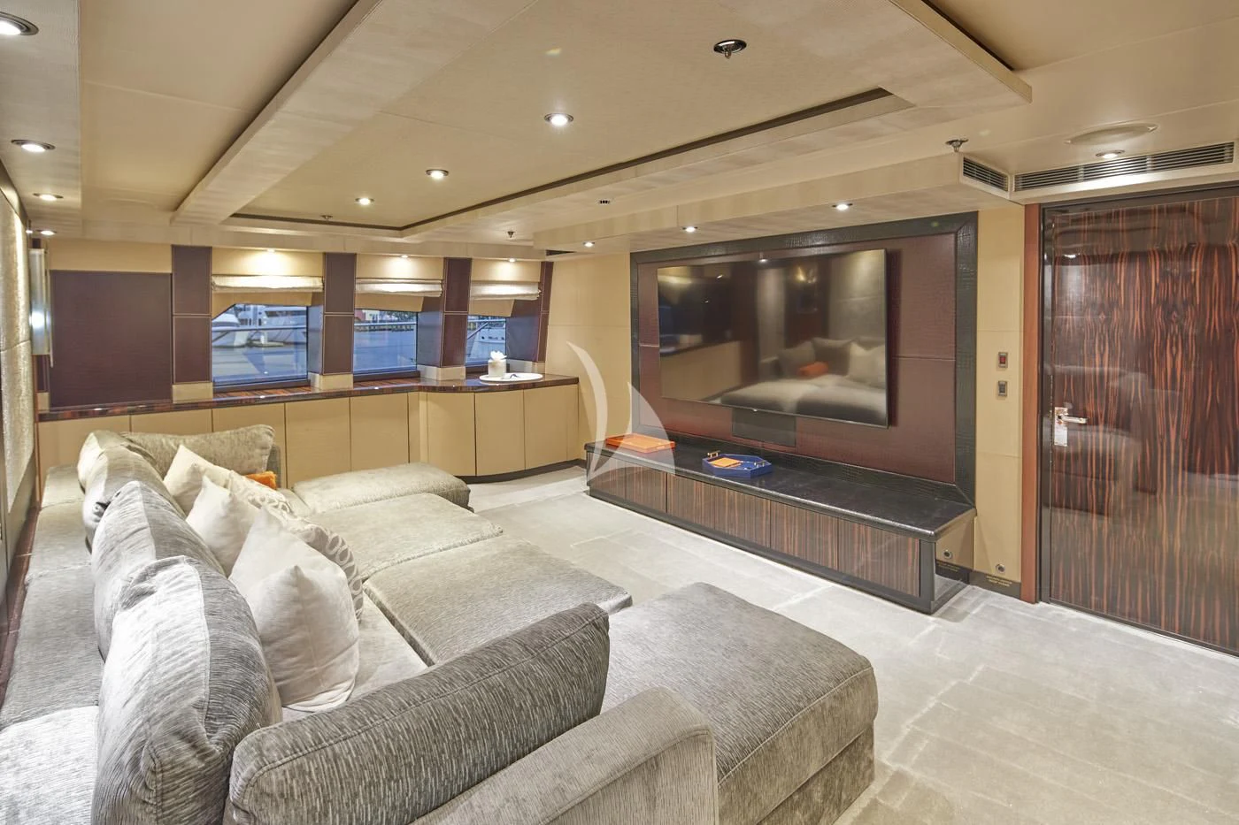 a living room with a couch and a tv aboard AQUANOVA Yacht for Sale