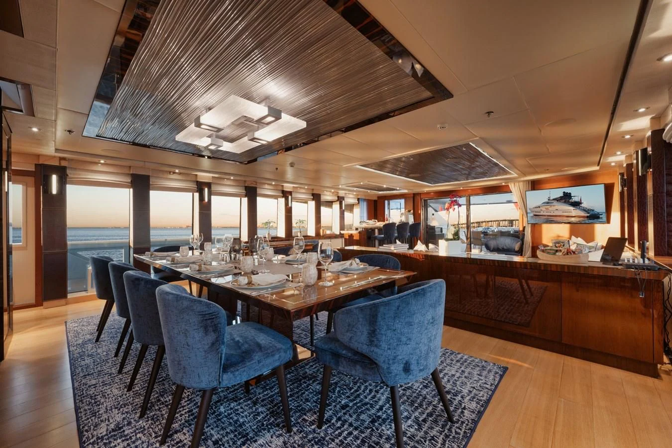 a large dining room with a table and chairs aboard AQUANOVA Yacht for Sale