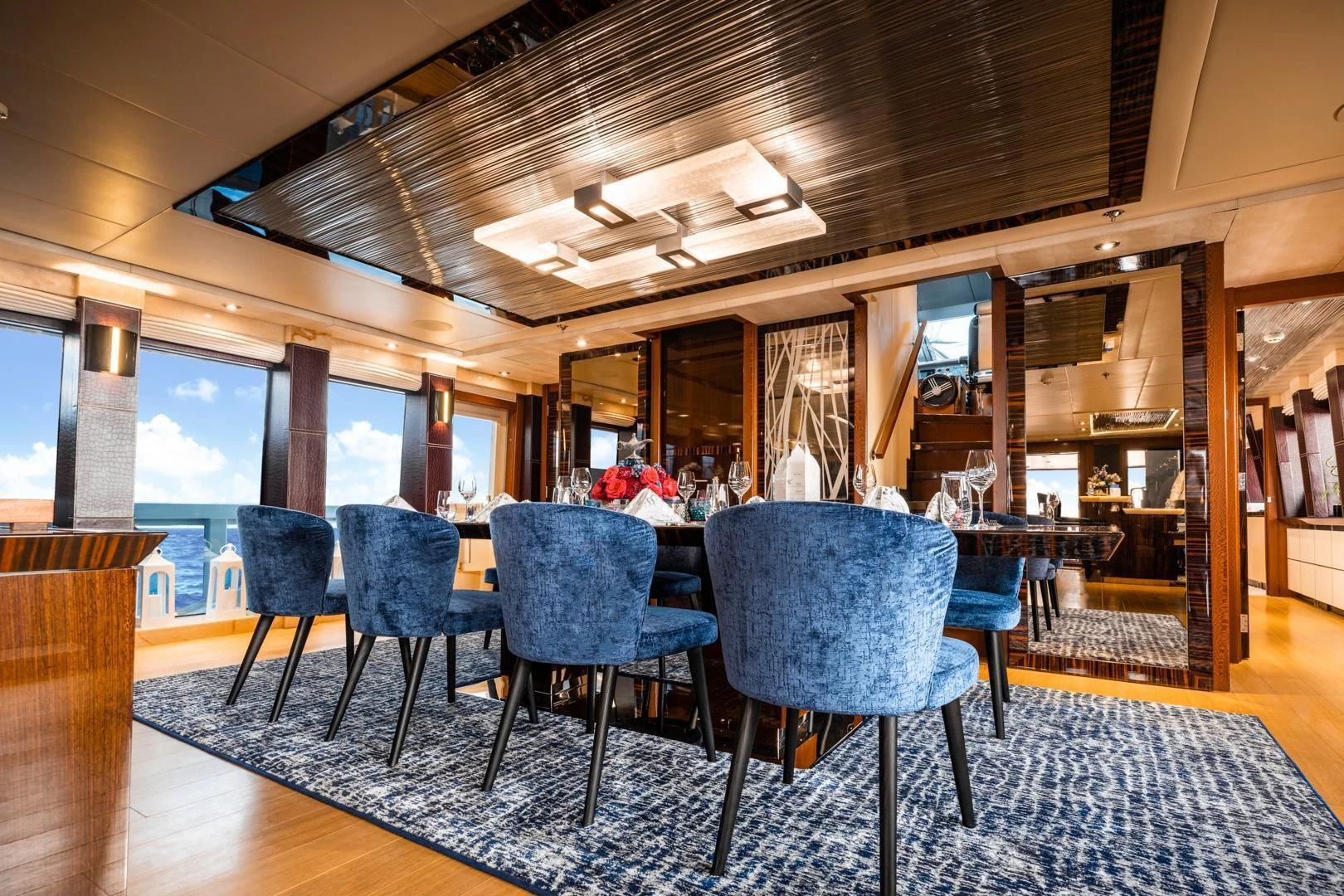 a large room with a table and chairs aboard AQUANOVA Yacht for Sale