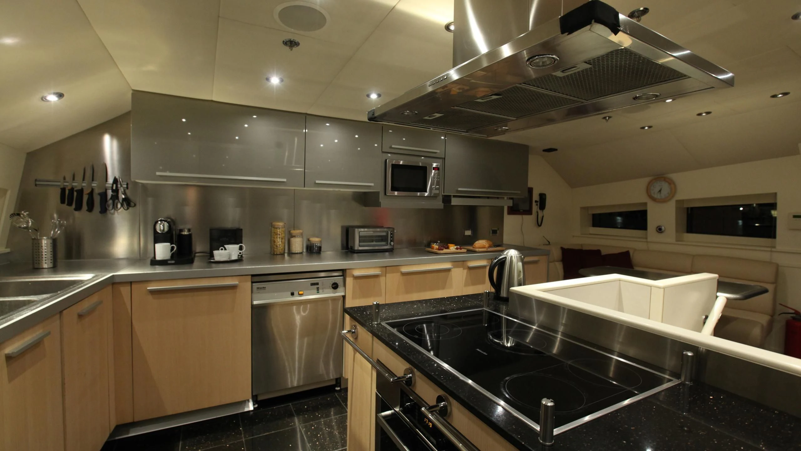 a kitchen with stainless steel appliances aboard AQUANOVA Yacht for Sale