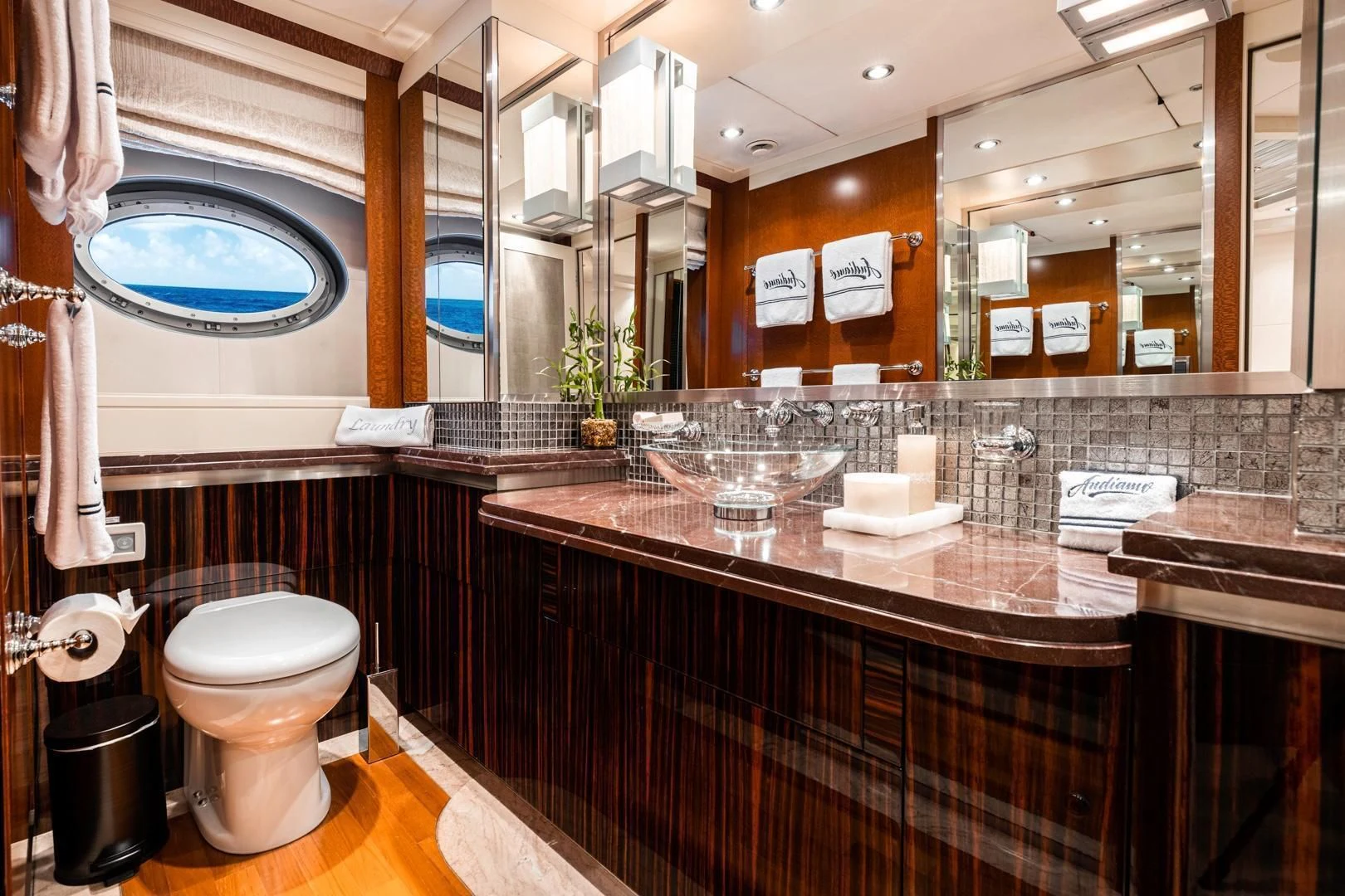a bathroom with a large mirror aboard AQUANOVA Yacht for Sale