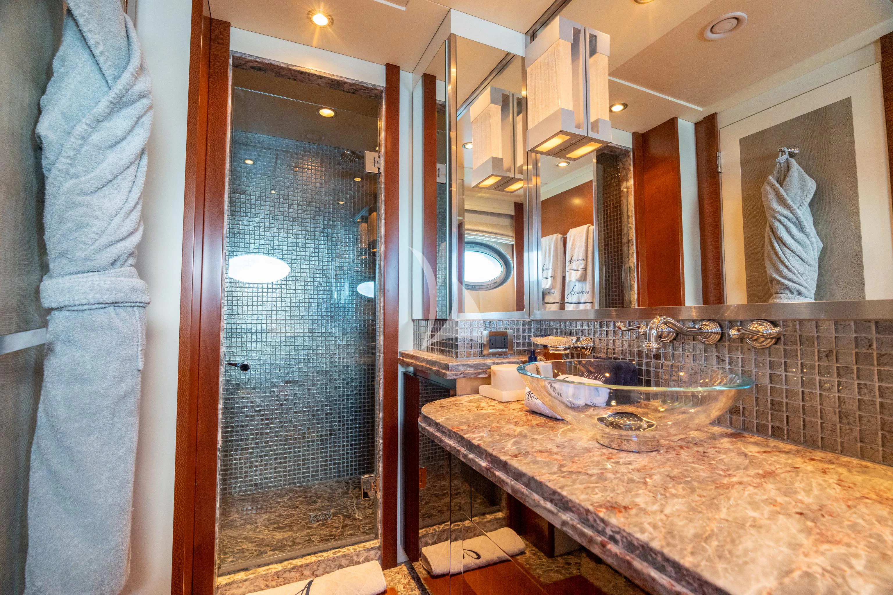 a bathroom with a countertop sink and a mirror aboard AQUANOVA Yacht for Sale