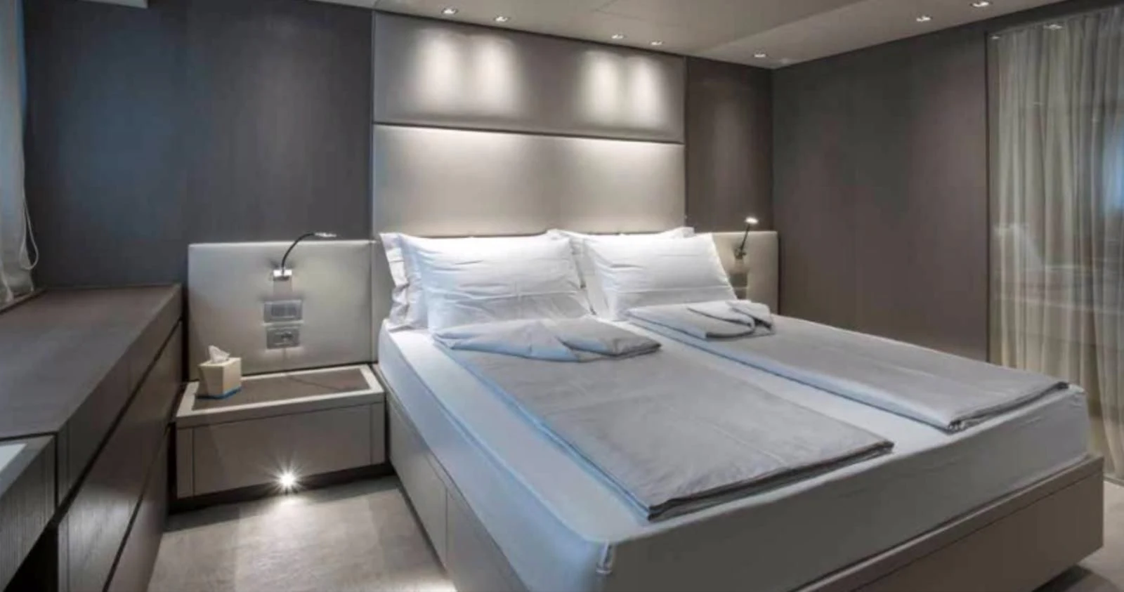 a room with a bed and a desk aboard MUMA Yacht for Sale