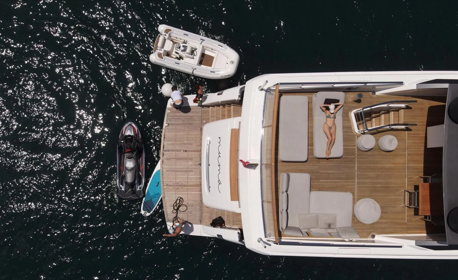 a person standing on a boat aboard MUMA Yacht for Sale