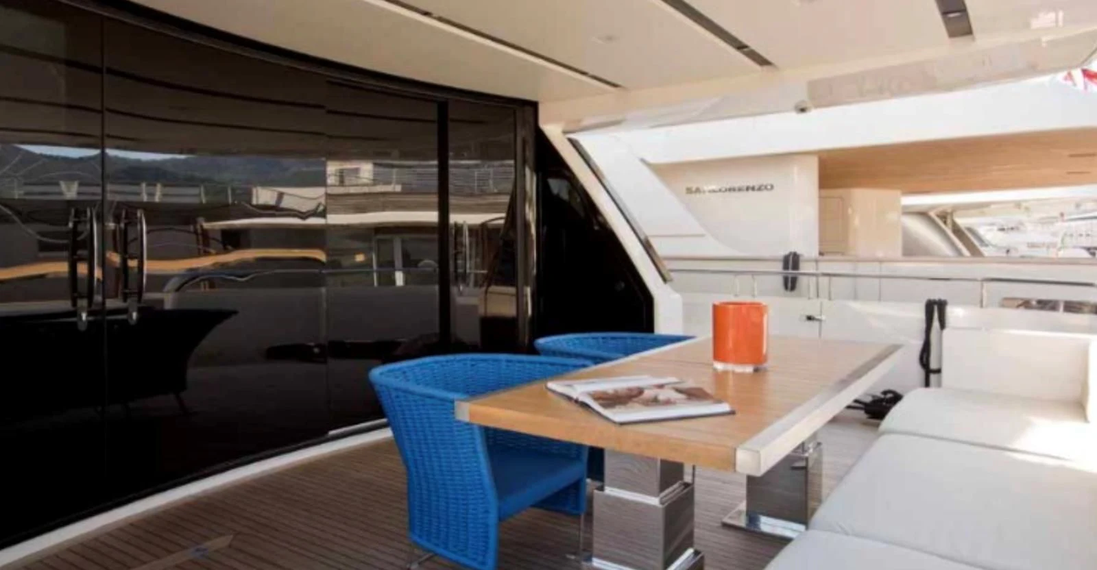 a room with a table and chairs aboard MUMA Yacht for Sale