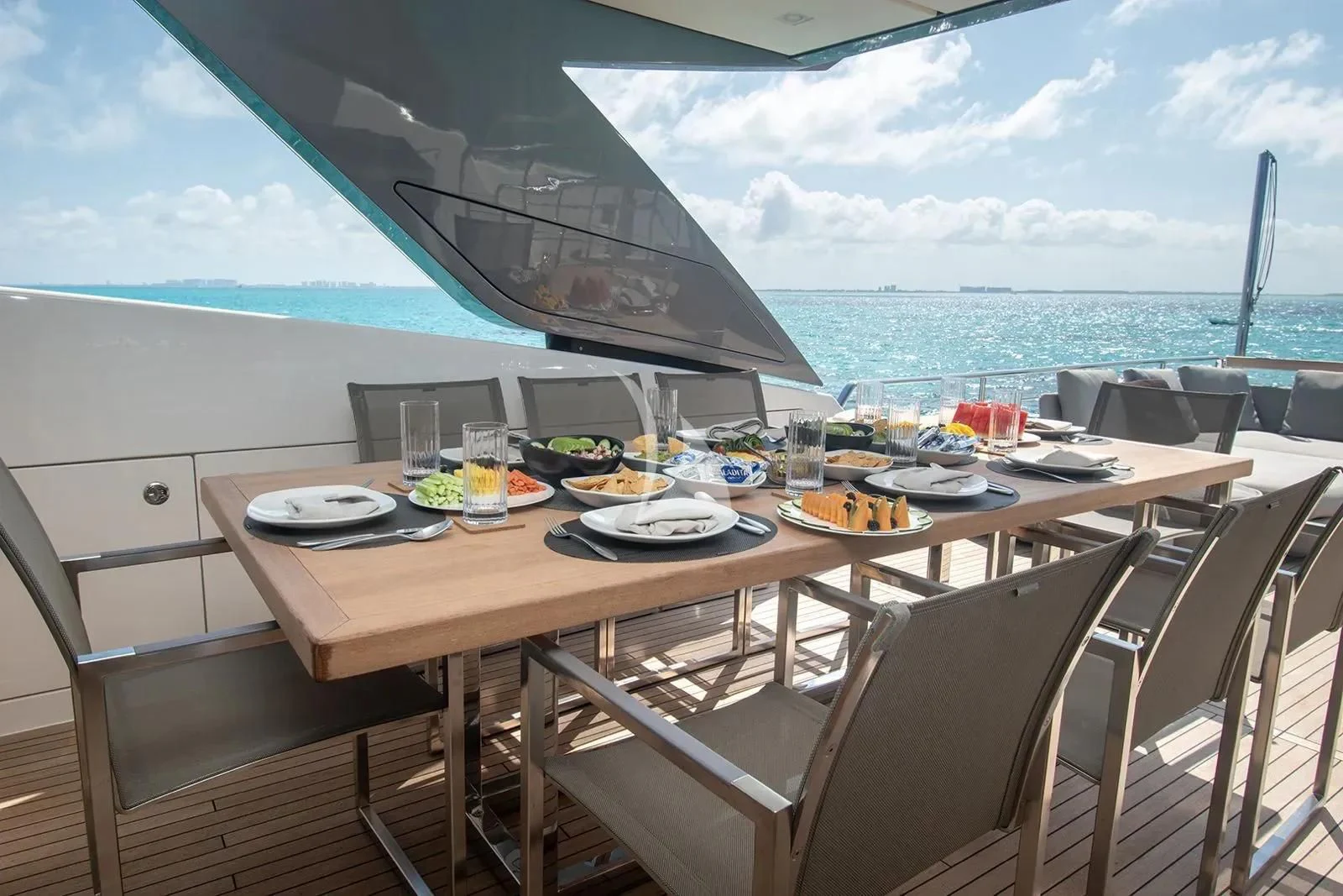 a table with plates and food on it aboard MUMA Yacht for Sale