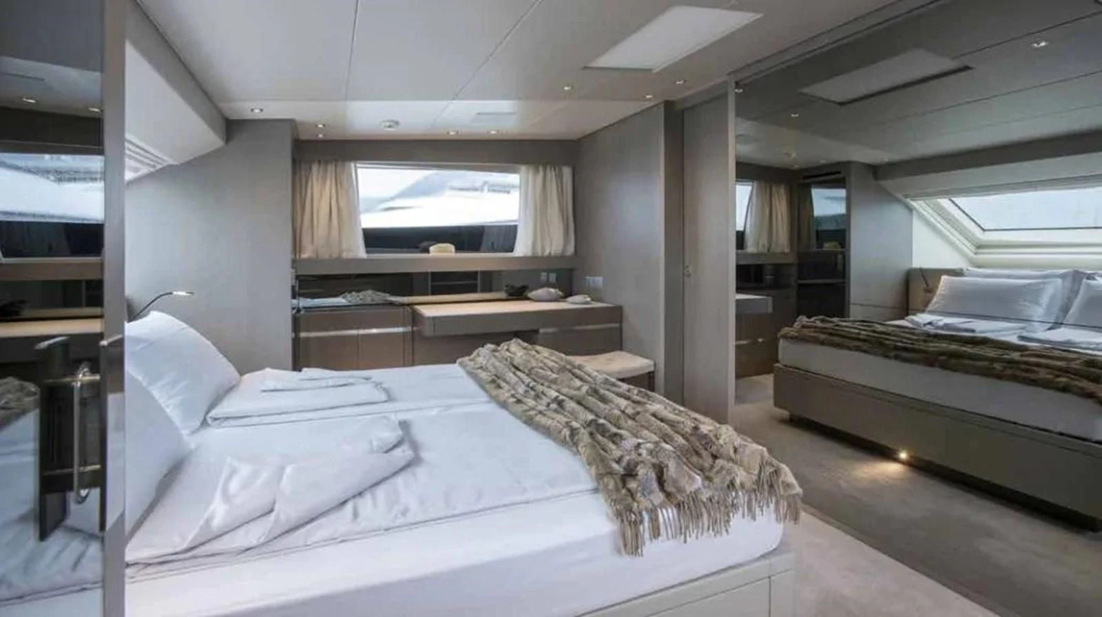 a room with a bed and a desk aboard MUMA Yacht for Sale