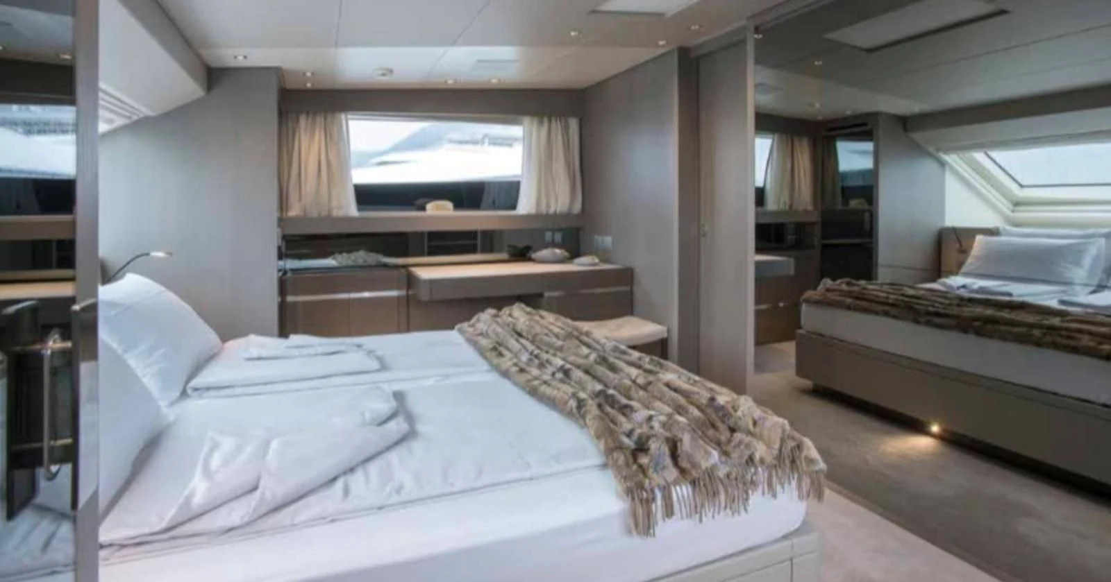 a room with a bed and a tv aboard MUMA Yacht for Sale