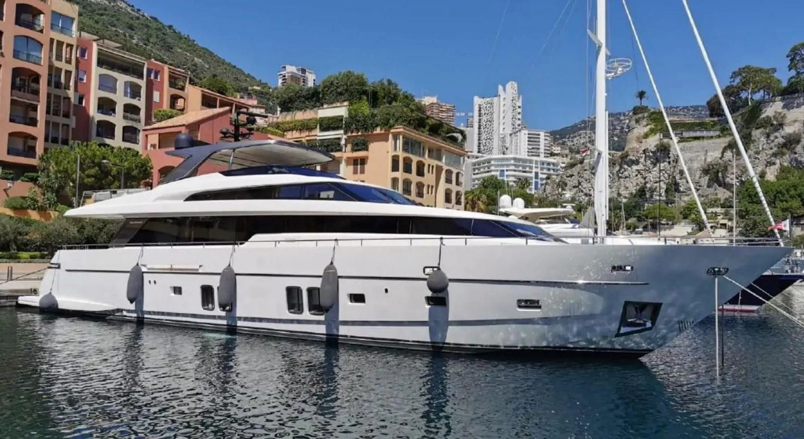 a boat docked at a pier aboard MUMA Yacht for Sale