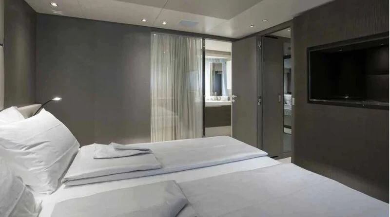 a hotel room with a bed aboard MUMA Yacht for Sale