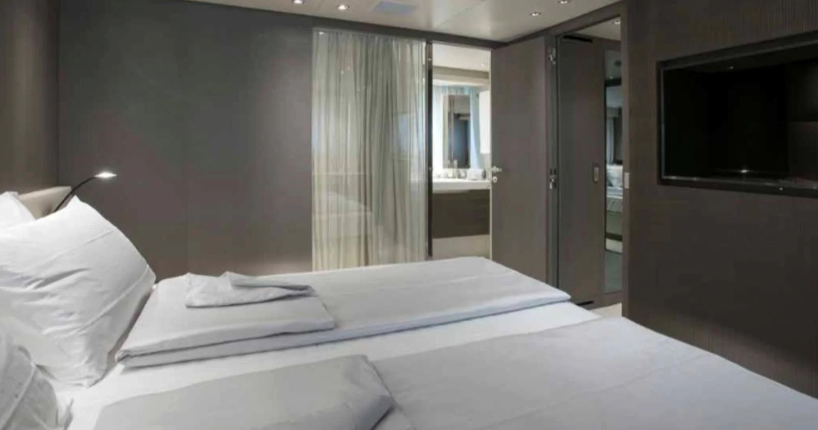 a hotel room with a bed aboard MUMA Yacht for Sale