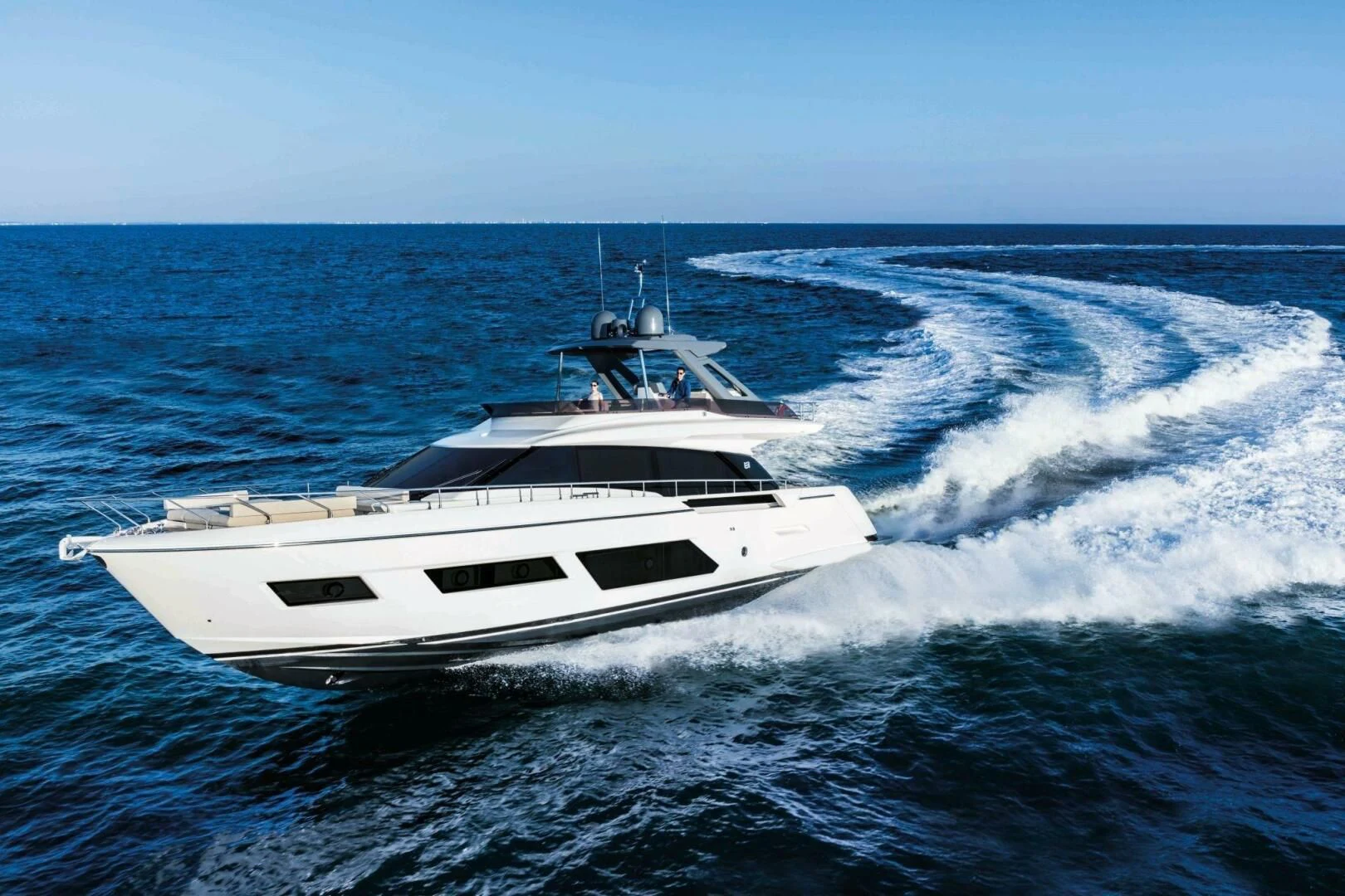 a white yacht on the water aboard OUR TRADE Yacht for Sale