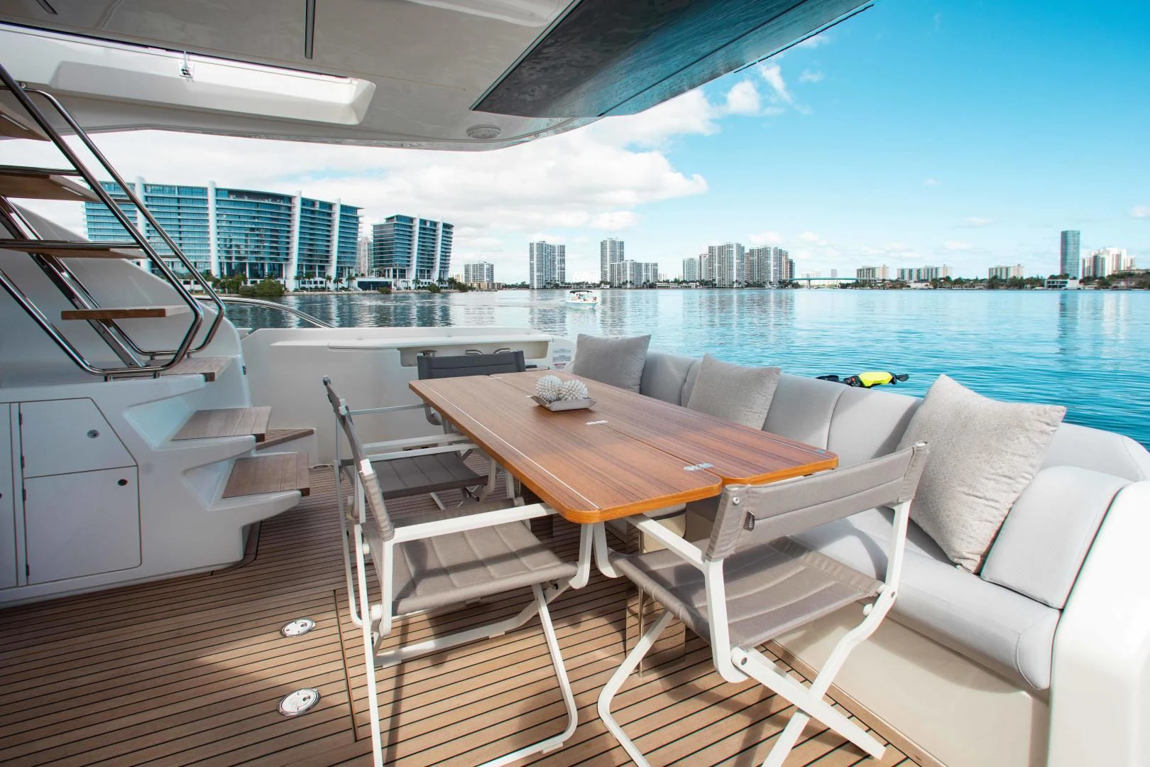 a table and chairs on a deck aboard OUR TRADE Yacht for Sale
