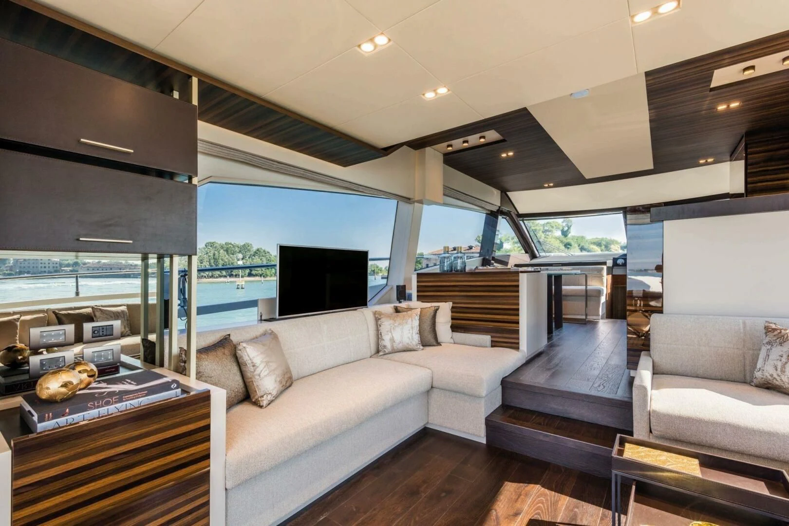 a living room with a large window aboard OUR TRADE Yacht for Sale