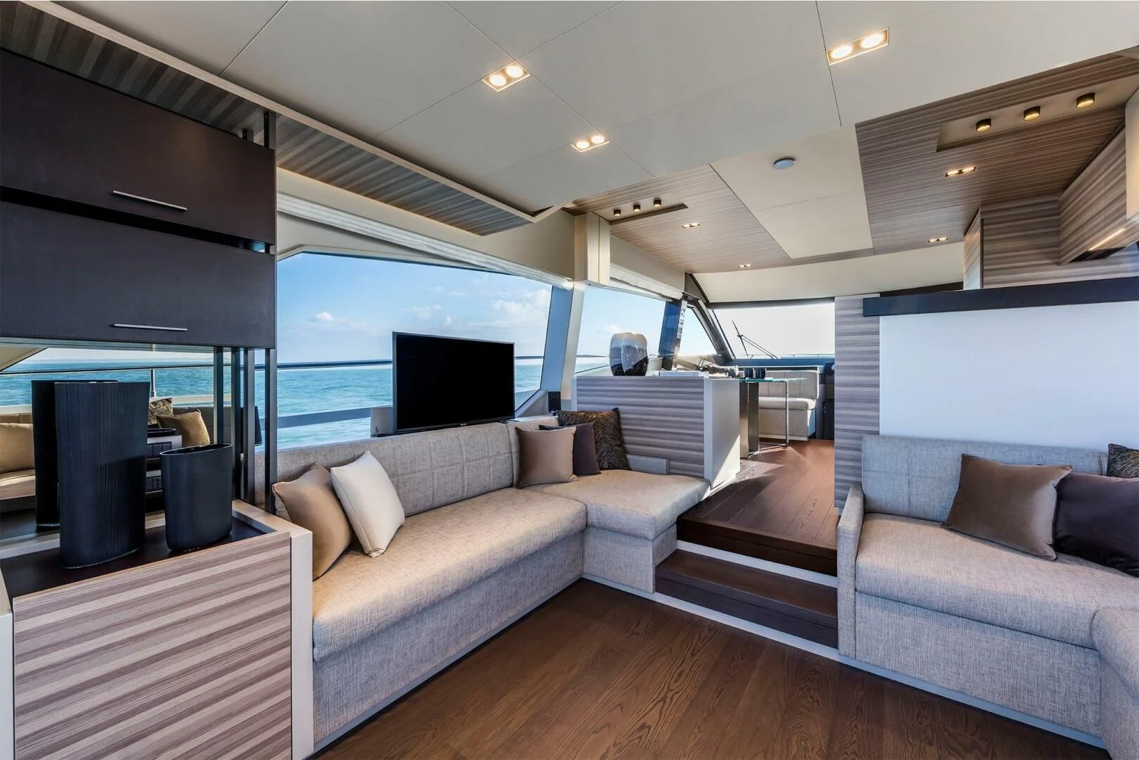 a living room with a large window aboard OUR TRADE Yacht for Sale