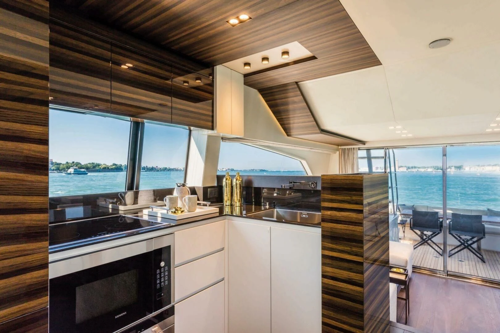 a kitchen with a large window aboard OUR TRADE Yacht for Sale