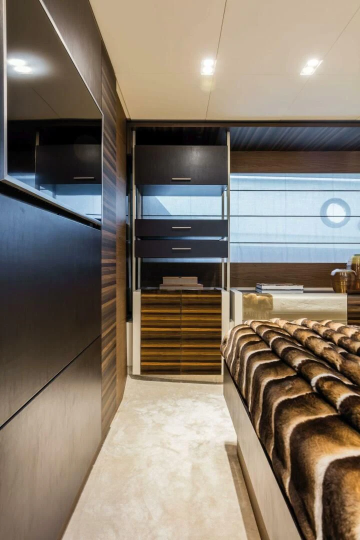 a room with a bed and a large closet aboard OUR TRADE Yacht for Sale