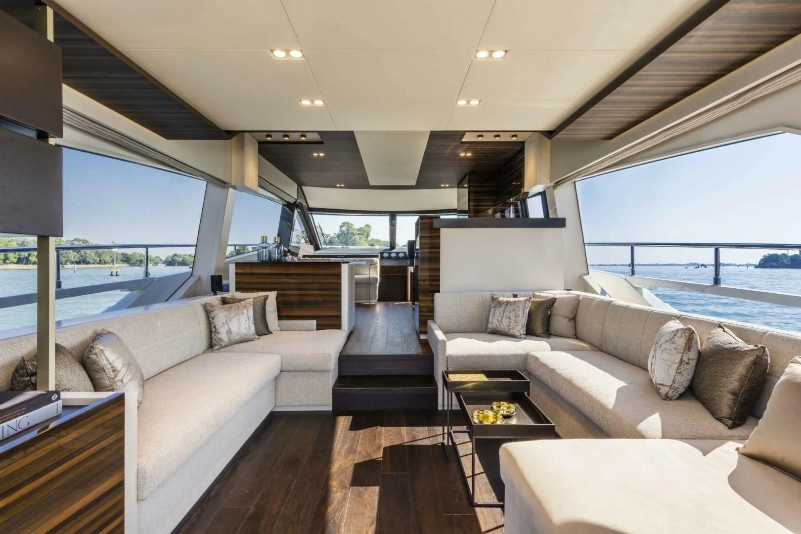 a living room with a large window aboard OUR TRADE Yacht for Sale