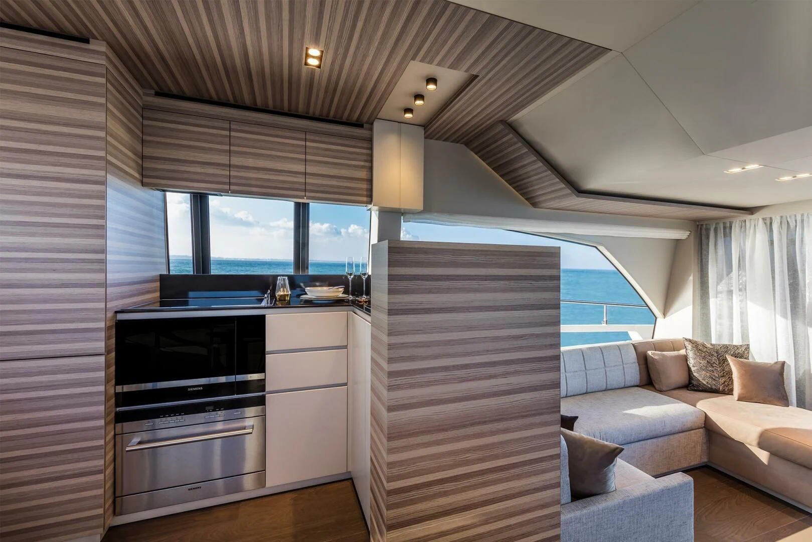 a room with a couch and a television aboard OUR TRADE Yacht for Sale