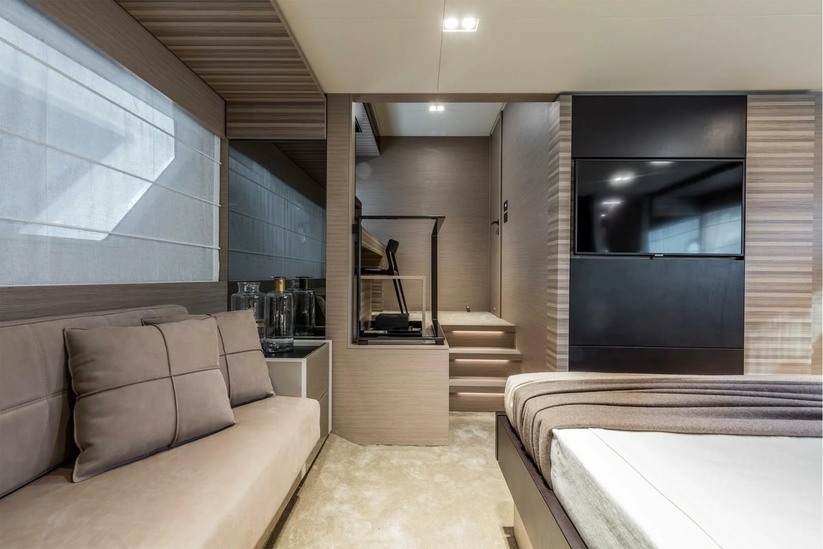 a modern looking bedroom with a large tv aboard OUR TRADE Yacht for Sale