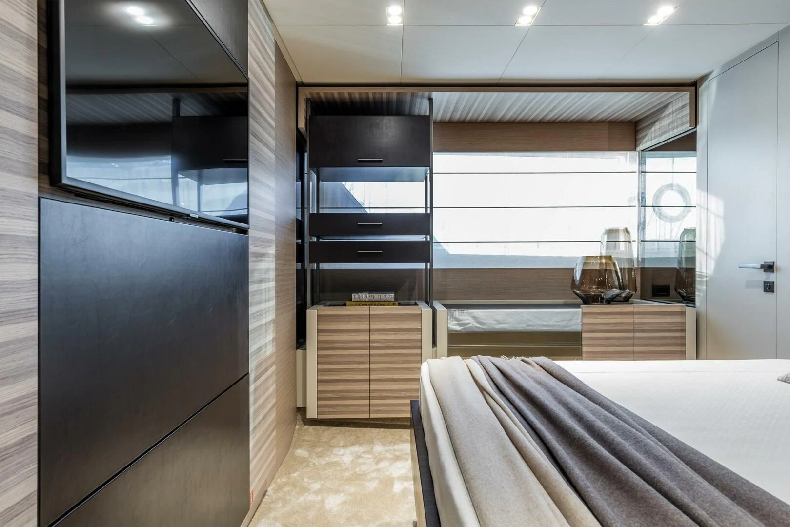 a room with a bed and a large window aboard OUR TRADE Yacht for Sale