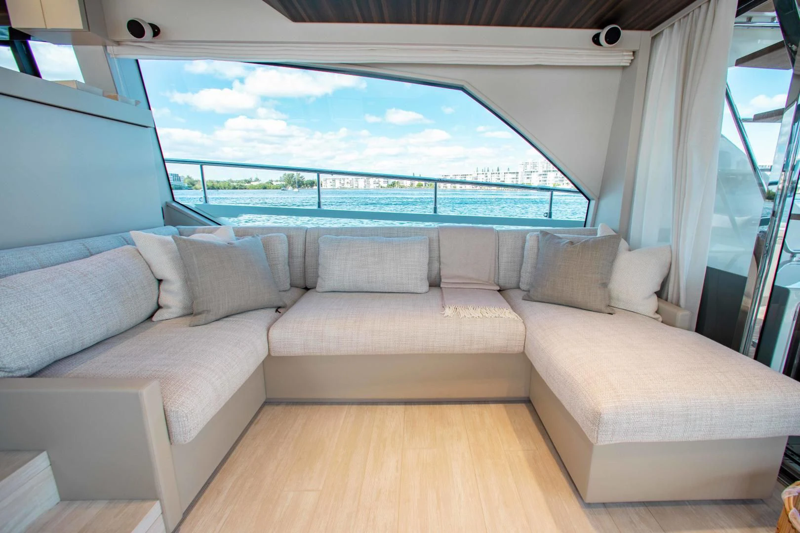 a couch and a window in a room aboard OUR TRADE Yacht for Sale