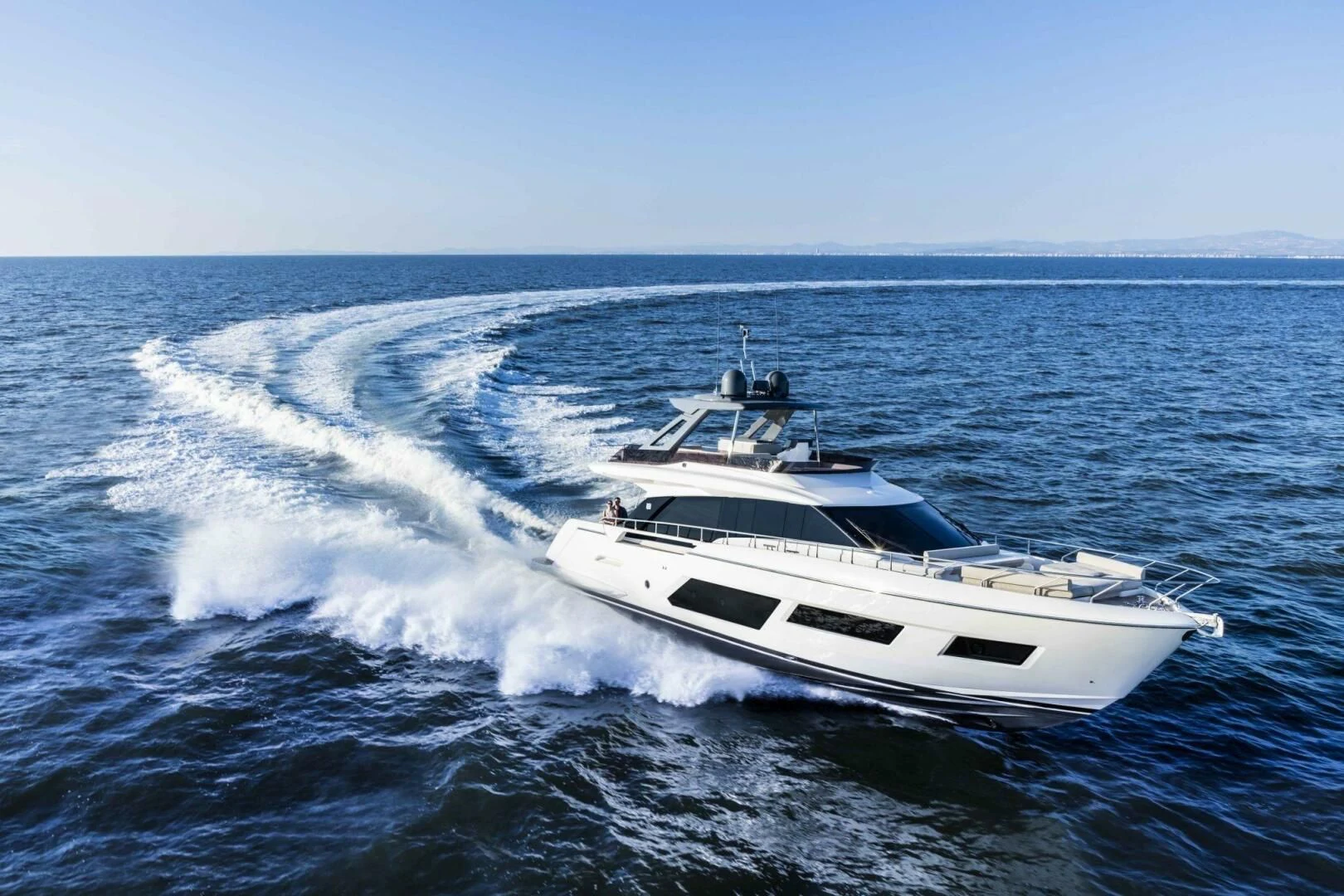 a white yacht on the water aboard OUR TRADE Yacht for Sale