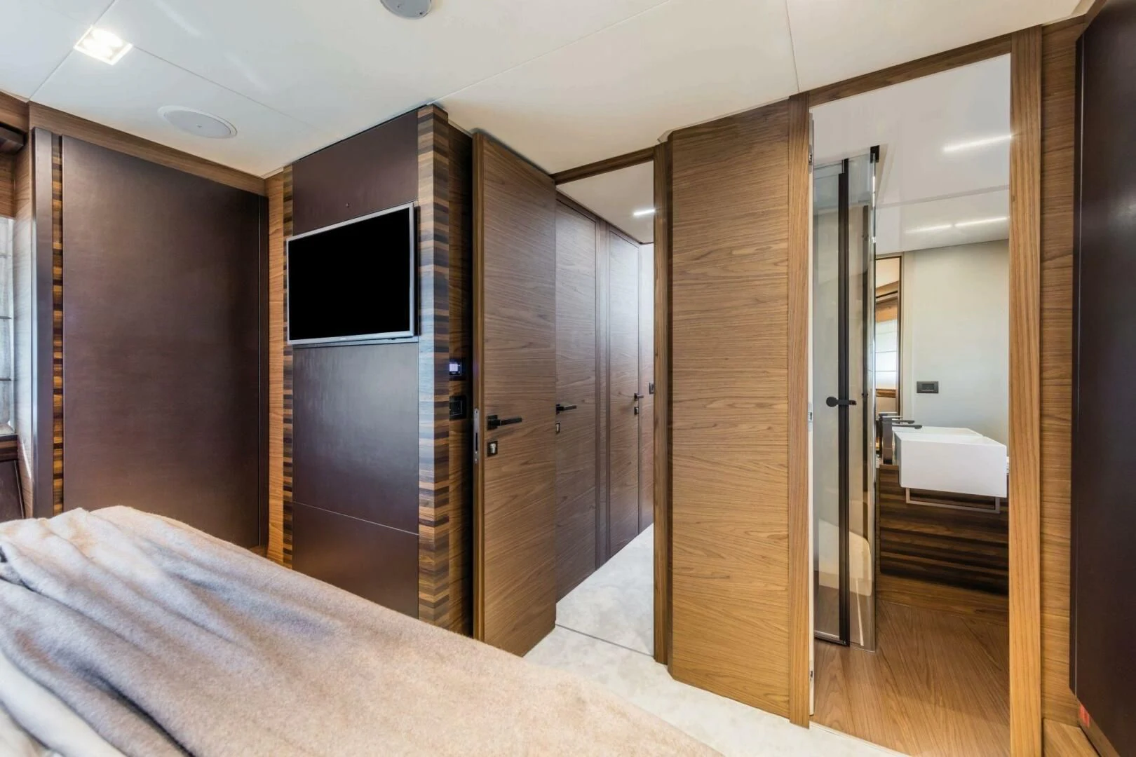 a room with a bed and a television aboard OUR TRADE Yacht for Sale