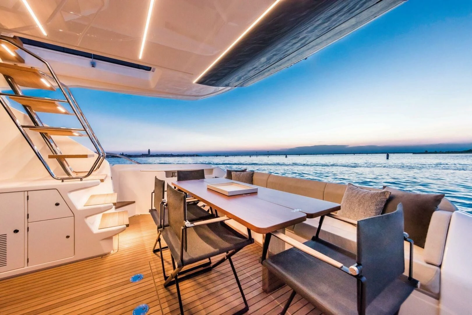 a room with a table and chairs and a view of the ocean aboard OUR TRADE Yacht for Sale