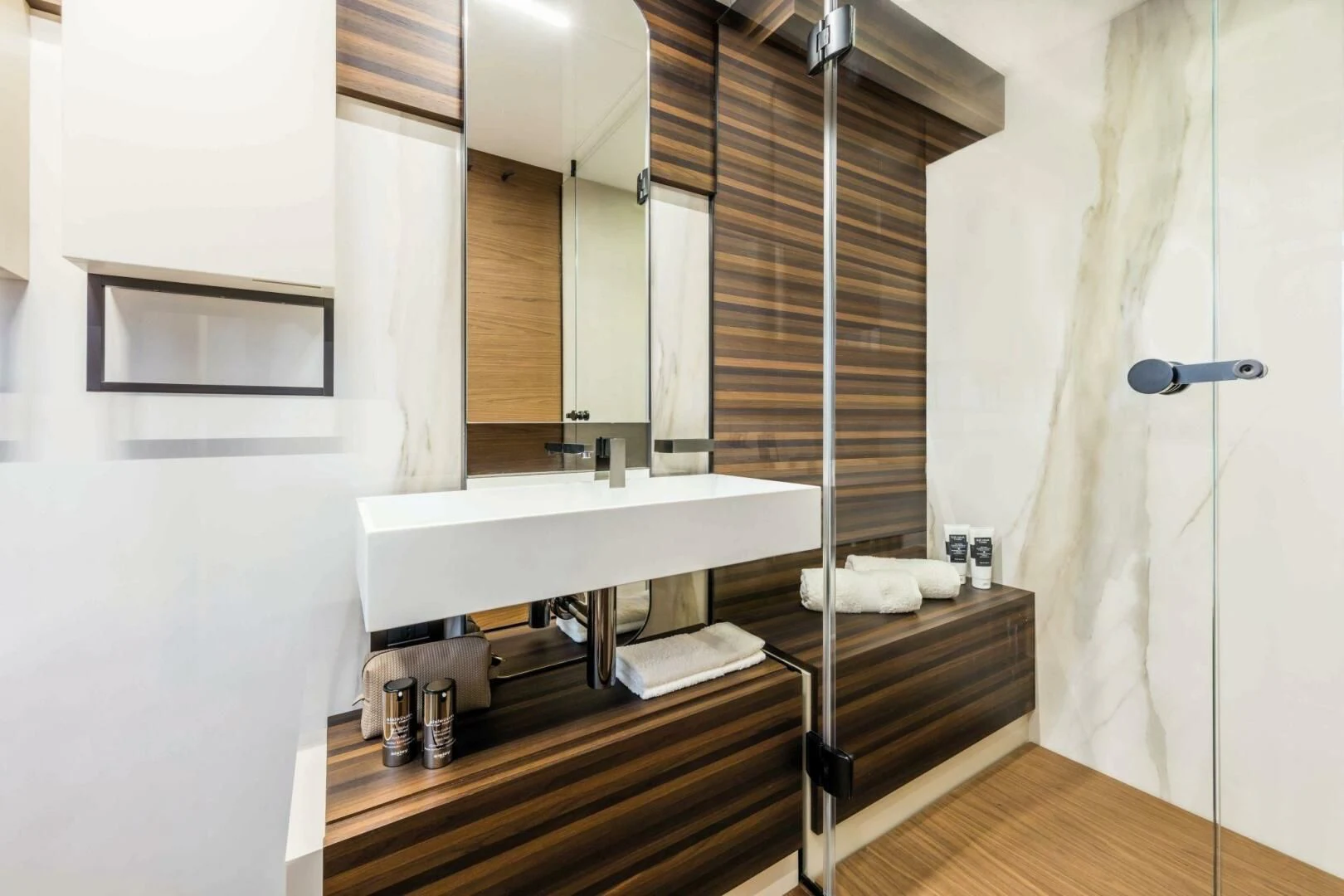 a bathroom with a sink and a mirror aboard OUR TRADE Yacht for Sale