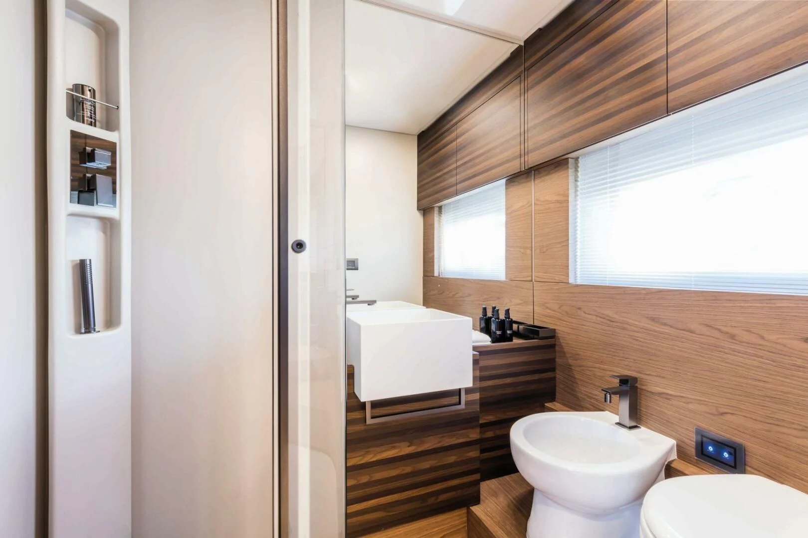 a bathroom with a toilet and a sink aboard OUR TRADE Yacht for Sale