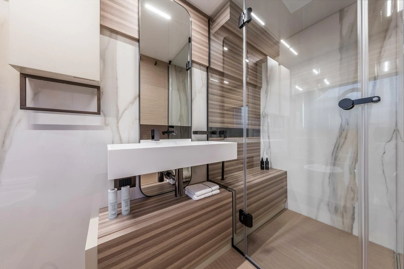 a bathroom with a sink and a shower aboard OUR TRADE Yacht for Sale