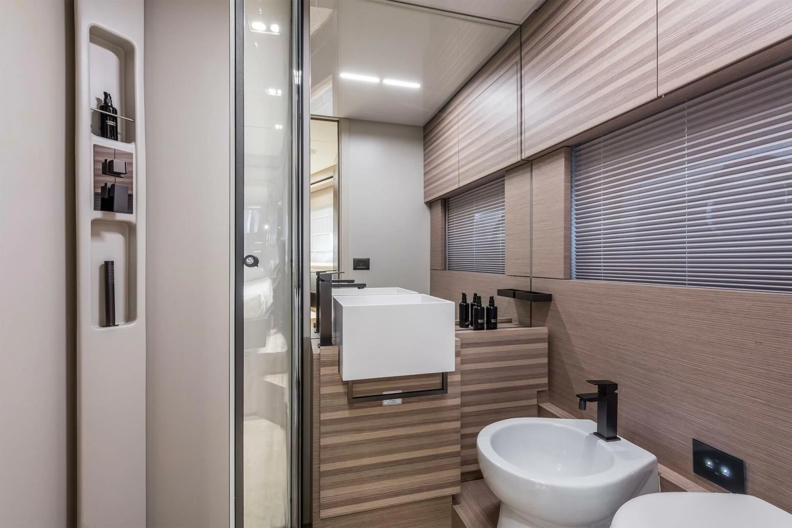 a bathroom with a glass shower aboard OUR TRADE Yacht for Sale