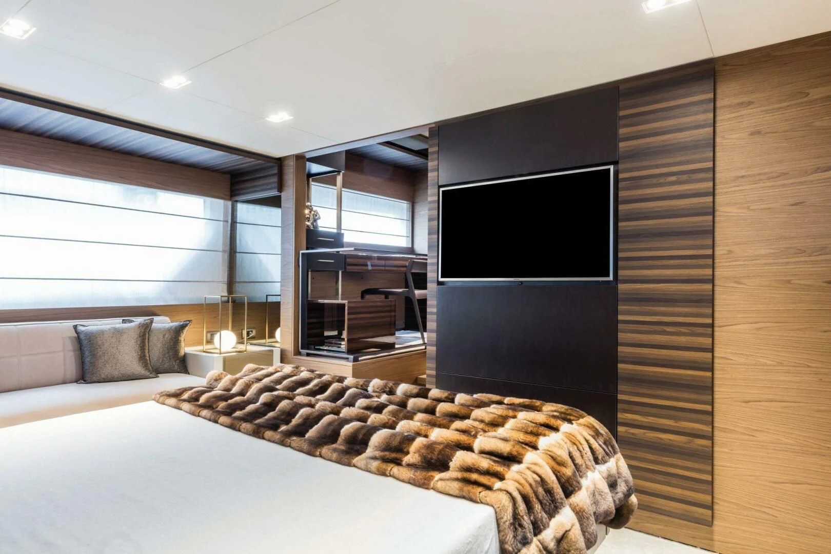 a living room with a large tv aboard OUR TRADE Yacht for Sale