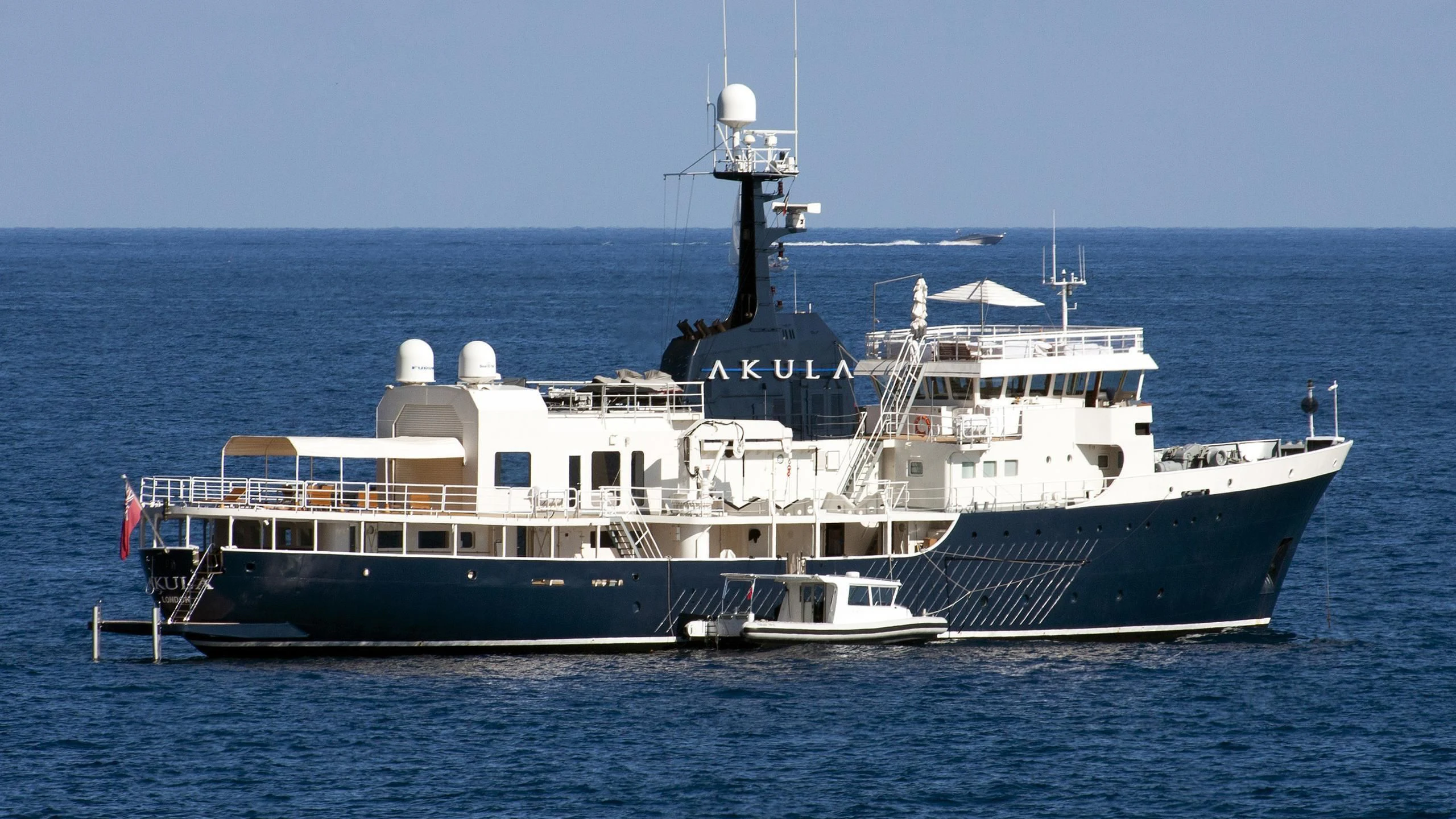 a large boat in the water aboard OMNIA Yacht for Sale