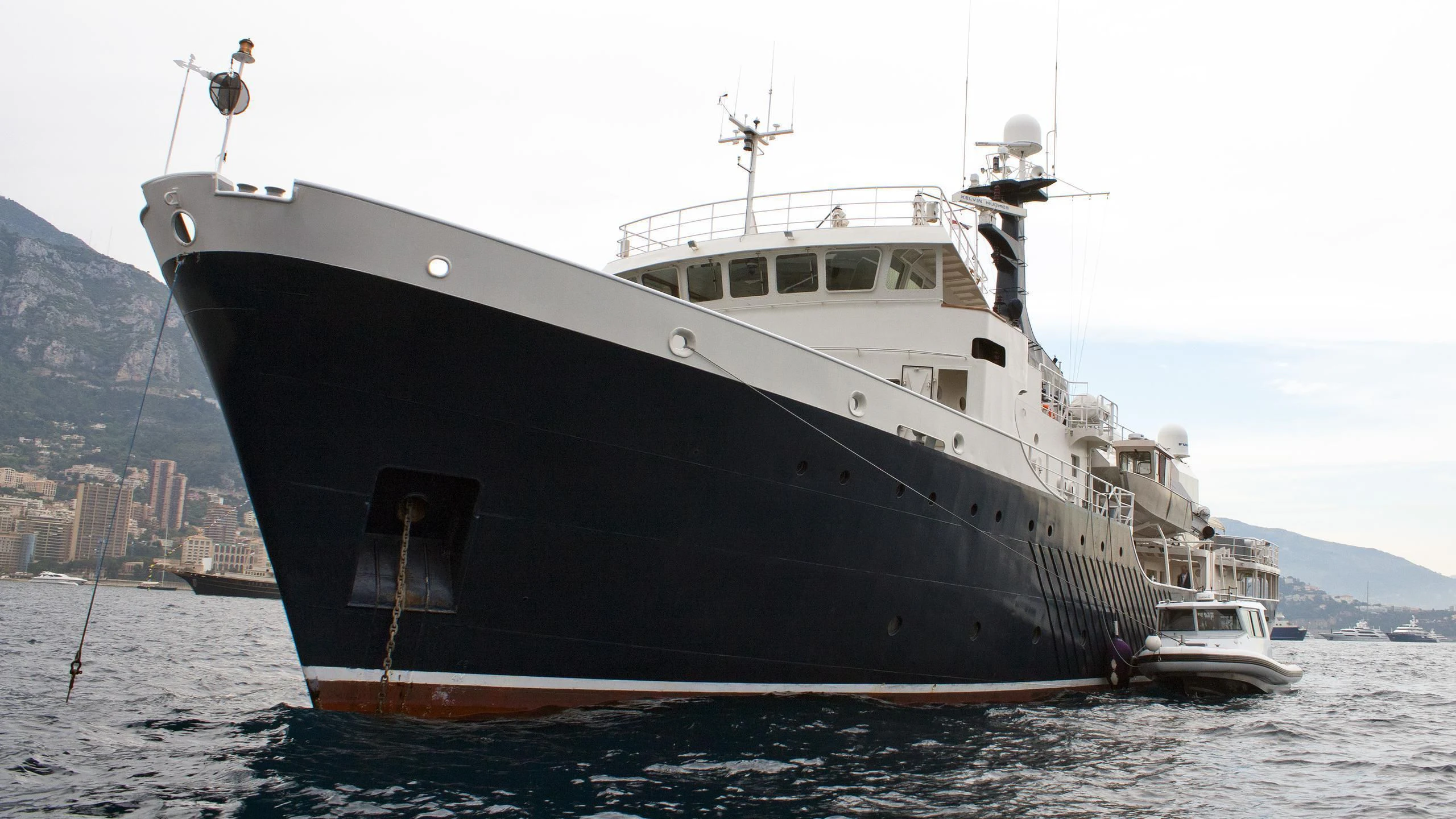 a large ship in the water aboard OMNIA Yacht for Sale